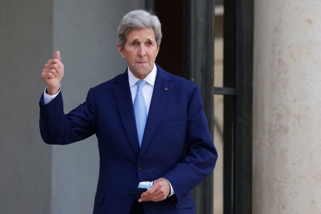 US Special Presidential Envoy for Climate John Kerry poses as he arrives for the One Plane