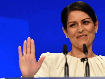 Britain's Home Secretary Priti Patel gestures as she speaks on the third day of the annual Conservative Party Conference at the Manchester Central convention centre in Manchester, northwest England, on October 5, 2021. (Photo by Ben STANSALL / AFP) (Photo by BEN STANSALL/AFP via Getty Images)