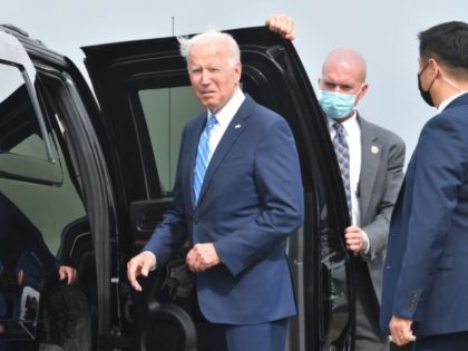 US President Joe Biden looks on after arriving on Airforce One at Chicago OHare International Airport in Chicago, Illinois on October 7, 2021, as he travels to promote the importance of Covid-19 vaccine requirements. (Photo by Nicholas Kamm / AFP) (Photo by NICHOLAS KAMM/AFP via Getty Images)