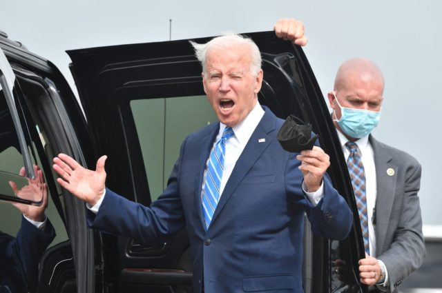 US President Joe Biden gestures to the media after arriving on Airforce One at Chicago OHare International Airport in Chicago, Illinois on October 7, 2021. (Photo by Nicholas Kamm / AFP) (Photo by NICHOLAS KAMM/AFP via Getty Images)