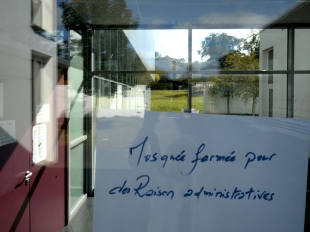 This photograph taken on October 13, 2021 shows a note reading 'mosque closed for administrative reasons' at the entrance to a mosque in Allones, north-western France. - The mosque which has been accused of legitimising terrorism or calling for jihad, regularly hosts some 300 worshippers and has a Koranic school …