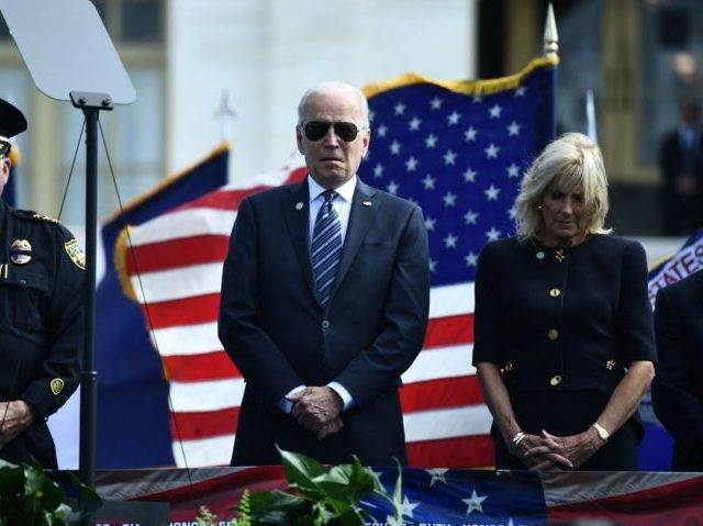US President Joe Biden and First Lady Jill Biden, with National Secretary of the Fraternal Order of Police, Jimmy Holderfield (L), attend the 40th Annual National Peace Officers Memorial Service at the US Capitol in Washington, DC, on October 16, 2021. (Photo by Brendan Smialowski / AFP) (Photo by BRENDAN …