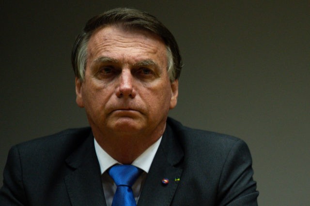 BRASILIA, BRAZIL - OCTOBER 22: President of Brazil Jair Bolsonaro gestures during a last minute press conference at the Ministry of Economy on October 22, 2021 in Brasilia, Brazil. Four key members of Guede's team had resigned on Thursday in disagreement with Bolsonaro's intention to increase public spending cap to fund …