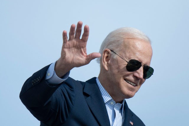 US President Joe Biden waves as he boards Air Force One at Andrews Air Force Base before departing for Italy and the United Kingdom on October 28, 2021 at Joint Base Andrews, Maryland. - President Biden is traveling to the G20 summit in Rome and COP26 in Glasgow. (Photo by …