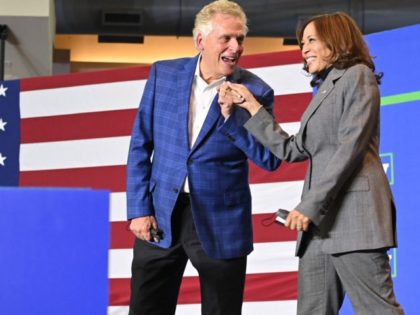 US Vice President Kamala Harris (R) is greeted with a fist bump by Virginia gubernatorial candidate Terry McAuliffe as she arrives to speak at his campaign rally at the Peter G. Decker Half Moone Center in Norfolk, Virginia on October 29, 2021. (Photo by MANDEL NGAN / AFP) (Photo by …