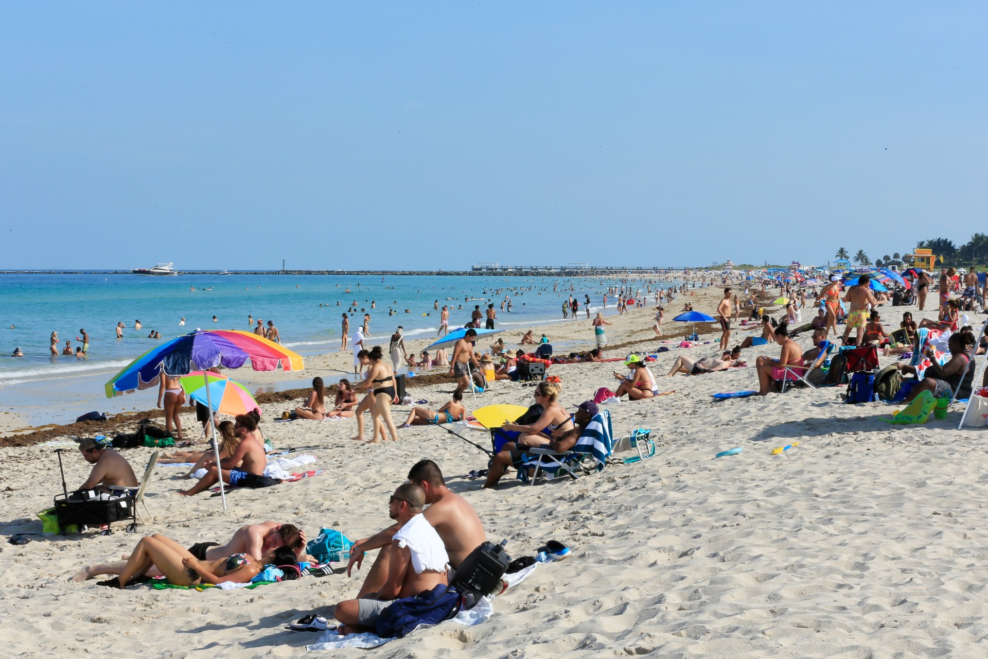 Beachgoers take advantage of the opening of South Beach on June 10, 2020 in Miami Beach, Florida. Miami-Dade county and the City of Miami opened their beaches today as the area eases restrictions put in place to contain COVID-19. (Photo by Cliff Hawkins/Getty Images)