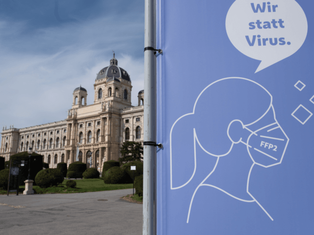 VIENNA, AUSTRIA - APRIL 01: A banner informs people to wear a FFP2 face mask outdoors at Maria-Theresien Platz on the first day of an Easter shutdown during the coronavirus pandemic on April 01, 2021 in Vienna, Austria. Authorities have declared the Easter period from April 1 to April 5, …