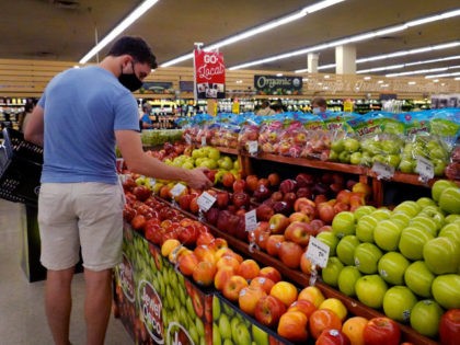 CHICAGO, ILLINOIS - JUNE 10: Customers shop for produce at a supermarket on June 10, 2021