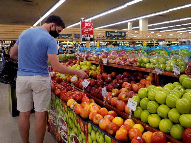 CHICAGO, ILLINOIS - JUNE 10: Customers shop for produce at a supermarket on June 10, 2021