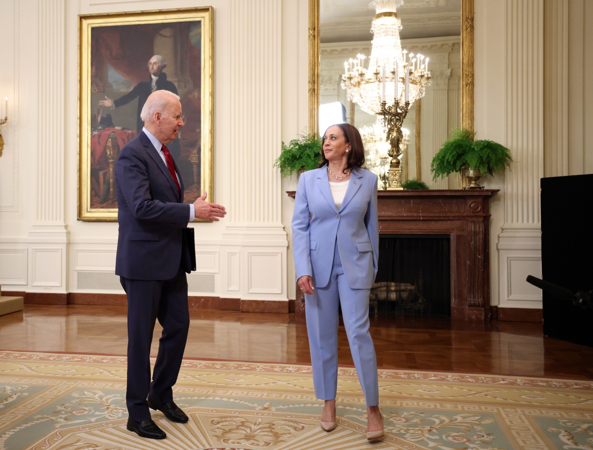 U.S. President Joe Biden talks to Vice President Kamala Harris after delivering remarks on the Senate's bipartisan infrastructure deal at the White House on June 24, 2021 in Washington, DC. Biden said both sides made compromises on the nearly $1 trillion infrastructure bill (Photo by Kevin Dietsch/Getty Images)