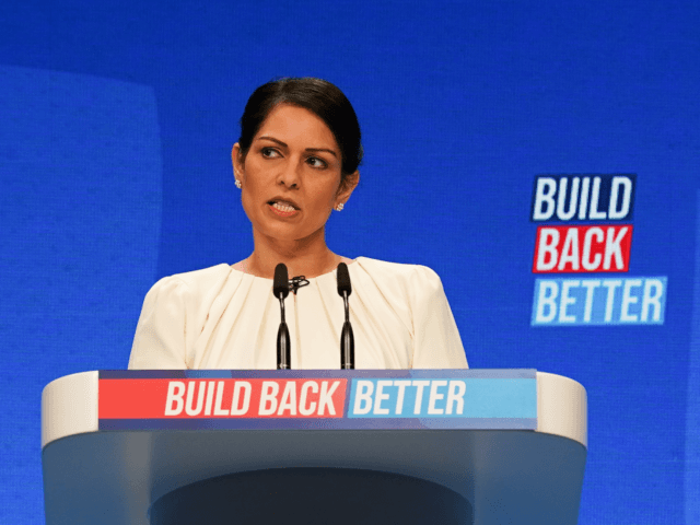 MANCHESTER, ENGLAND - OCTOBER 05: Priti Patel, Secretary of State for the Home Department delivers her keynote speech during the Conservative Party Conference at Manchester Central Convention Complex on October 05, 2021 in Manchester, England. This year's Conservative Party Conference returns as a hybrid of in-person and online events after …