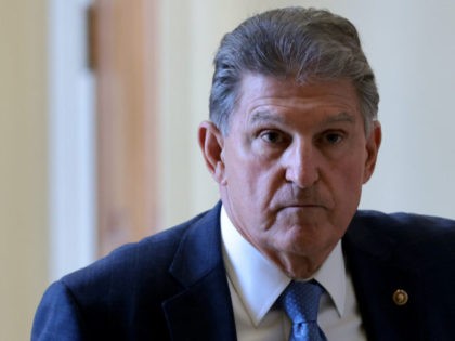 WASHINGTON, DC - OCTOBER 07: Sen. Joe Manchin (D-WV) leaves a Democratic luncheon at the U.S. Capitol October 7, 2021 in Washington, DC. Senate Democrats and Republicans have reached a deal that will temporarily raise the debt ceiling through early December.(Photo by Win McNamee/Getty Images)