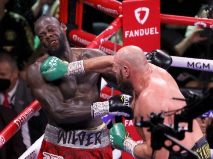 LAS VEGAS, NEVADA - OCTOBER 09: Tyson Fury (R) hits Deontay Wilder in the eighth round of their WBC heavyweight title fight at T-Mobile Arena on October 9, 2021 in Las Vegas, Nevada. Fury retained his title with an 11th-round knockout. (Photo by Ethan Miller/Getty Images)