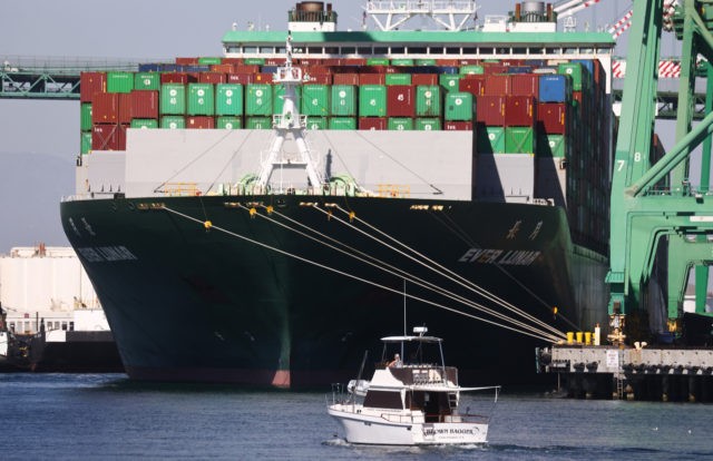 SAN PEDRO, CALIFORNIA - OCTOBER 15: A recreational boat passes near the Ever Lunar container ship at the Port of Los Angeles, the nation’s busiest container port, on October 15, 2021 in San Pedro, California. As surging inflation and supply chain disruptions are disrupting global economic recovery, the Washington-based IMF …