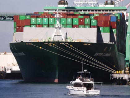 SAN PEDRO, CALIFORNIA - OCTOBER 15: A recreational boat passes near the Ever Lunar container ship at the Port of Los Angeles, the nation’s busiest container port, on October 15, 2021 in San Pedro, California. As surging inflation and supply chain disruptions are disrupting global economic recovery, the Washington-based IMF …
