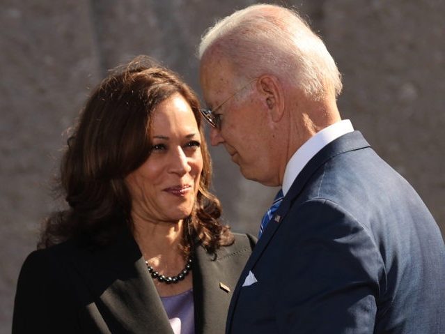 WASHINGTON, DC - OCTOBER 21: U.S. President Joe Biden (R) and Vice President Kamala Harris shake hands during the 10th-anniversary celebration of the Martin Luther King, Jr. Memorial near the Tidal Basin on the National Mall on October 21, 2021 in Washington, DC. Biden attended the memorial's dedication ceremony in 2011 with then President Barack Obama who delivered the keynote address. (Photo by Chip Somodevilla/Getty Images)