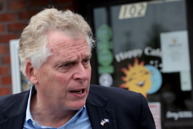 VIRGINIA BEACH, VIRGINIA - OCTOBER 25: Democratic gubernatorial candidate, former Virginia Gov. Terry McAuliffe answers questions from reporters after speaking during a campaign event where he received the endorsement of the Virginia Beach African American Political Action Council at The Happy Cafe on October 25, 2021 in Virginia Beach, Virginia. …