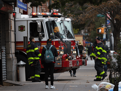 Firefighters watch as their fire engine enters the FDNY Engine 281/Ladder 147 station on October 29, 2021 in the Flatbush neighborhood of Brooklyn borough in New York City. According to the NYC Mayor's office, 86% of the city's 378,000 municipal workers have received at least one dose of the coronavirus …