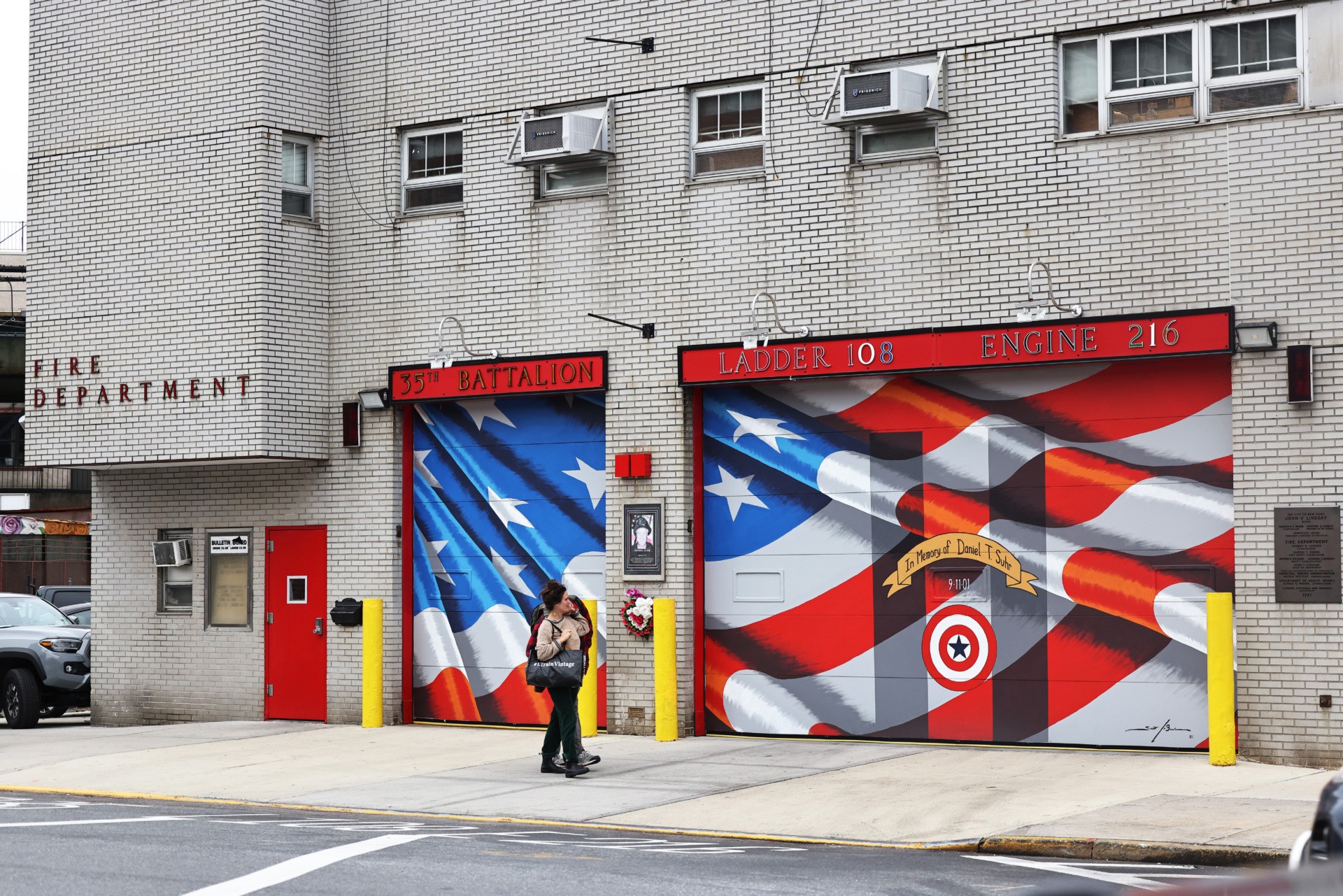 NEW YORK, NEW YORK - OCTOBER 29: People walk past the FDNY Engine Co. 216 station house on October 29, 2021 in the Williamsburg neighborhood of Brooklyn borough in New York City. According to the NYC Mayor's office, 86% of the city's 378,000 municipal workers have received at least one dose of the coronavirus (COVID-19) vaccine. The mayor has given municipal workers until 5 P.M. tonight to get vaccinated and has also eliminated the option to get tested weekly. Vaccination rates amongst city first responders are the lowest of all of the cities agencies. (Photo by Michael M. Santiago/Getty Images)