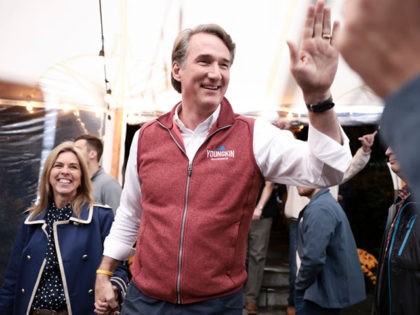 WARRENTON, VIRGINIA - OCTOBER 29: Republican gubernatorial candidate Glenn Youngkin and Suzanne Youngkin greet people as they arrive at the the Inn at Vint Hill on October 29, 2021 in Warrenton, Virginia. Youngkin is on a campaign bus tour across the state of Virginia as he contests Democratic candidate and …