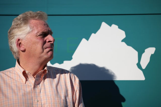 NORFOLK, VIRGINIA - OCTOBER 30: Democratic gubernatorial candidate, former Virginia Gov. Terry McAuliffe waits to speak while campaigning during a bus tour at the Iron Workers Local Union 79 October 30, 2021 in Norfolk, Virginia. The Virginia gubernatorial election, pitting McAuliffe against Republican candidate Glenn Youngkin, is November 2. (Photo …
