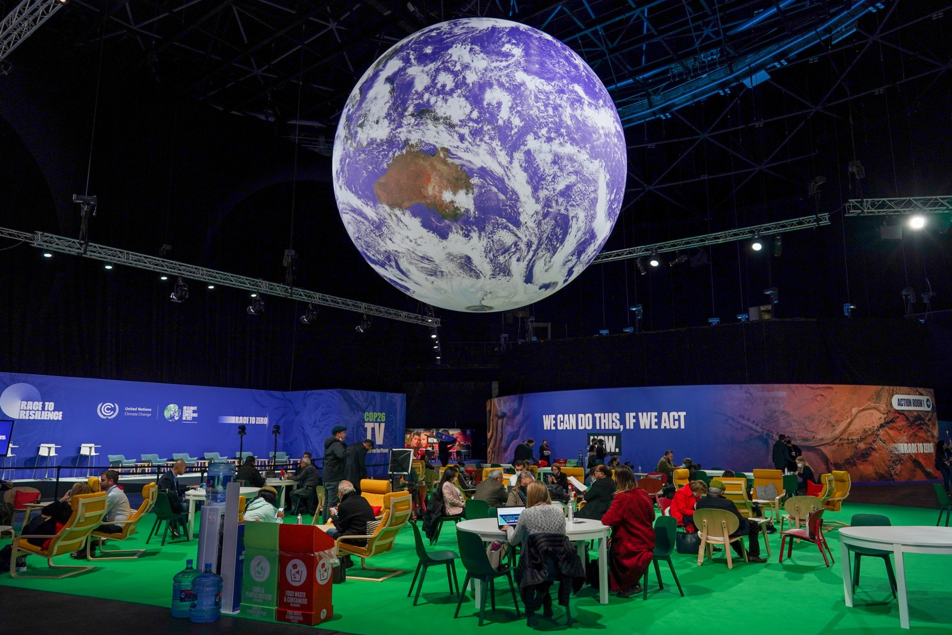 GLASGOW, SCOTLAND - OCTOBER 31: A giant globe hangs from the ceiling as delegates attend on day one of the COP 26 United Nations Climate Change Conference on October 31, 2021 in Glasgow, Scotland. 2021 sees the 26th United Nations Climate Change Conference. The conference will run from 31 October for two weeks, finishing on 12 November. It was meant to take place in 2020 but was delayed due to the Covid-19 pandemic. (Photo by Ian Forsyth/Getty Images)