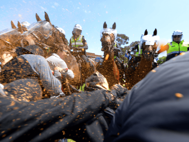 Members of the Campaign Against Racism and Fascism get sprayed with pepper spray as they clash with police on horses as they try to reach the anti-Islam group Reclaim Australia at a protest over plans for a mosque in Melton as Campaign Against Racism and Fascism are holding a counter-rally …