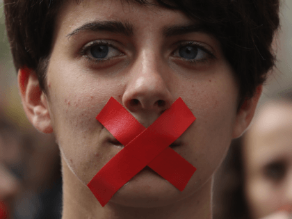 BARCELONA, SPAIN - OCTOBER 02: Students hold a silent protest against the violence that marred yesterday's referendum vote outside the University on October 2, 2017 in Barcelona, Spain. Catalonia's government met Monday to discuss plans to declare independence after the results of yesterday's disputed referendum. (Photo by Dan Kitwood/Getty Images)