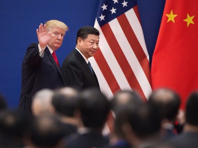 TOPSHOT - US President Donald Trump (L) and China's President Xi Jinping leave a business leaders event at the Great Hall of the People in Beijing on November 9, 2017. Donald Trump urged Chinese leader Xi Jinping to work "hard" and act fast to help resolve the North Korean nuclear …