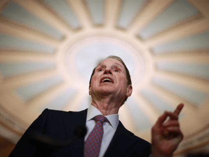 U.S. Sen. Ron Wyden (D-OR) talks with reporters following the weekly Democratic policy luncheon at the U.S. Capitol April 17, 2018 in Washington, DC. Noting that Tuesday was Tax Day, the Democrats said the recent tax reform legislation penned by Republicans was mostly benefitting corporations and their shareholders. (Photo by …