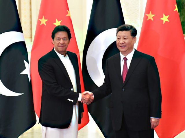 China's President Xi Jinping (R) shakes hands with Pakistan's Prime Minister Imran Khan (L) before their meeting at the Great Hall of the People in Beijing on April 28, 2019. (Photo by MADOKA IKEGAMI / POOL / AFP) (Photo credit should read MADOKA IKEGAMI/AFP via Getty Images)
