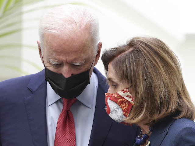 President Joe Biden talks to Speaker of the House Nancy Pelosi (D-CA) as they leave a House Democratic caucus meeting at the U.S. Capitol on October 01, 2021, in Washington, DC. (Kevin Dietsch/Getty Images)
