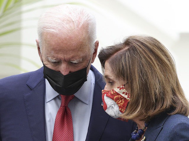 President Joe Biden talks to Speaker of the House Nancy Pelosi (D-CA) as they leave a Hous