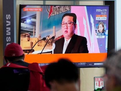 People watch a TV screen showing an image of North Korean leader Kim Jong Un during a news program at the Seoul Railway Station in Seoul, South Korea, Tuesday, Oct. 12, 2021. Kim reviewed a rare exhibition of weapons systems and vowed to build an "invincible" military, as he accused …