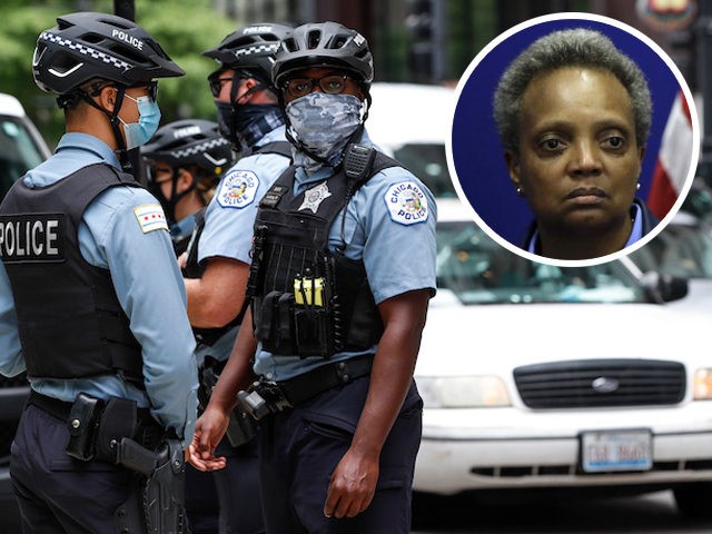 Chicago Police Officers monitor the Occupy City Hall Protest and Car Caravan hosted by Chicago Teachers Union in Chicago, Illinois, on August 3, 2020. (Kamil Krzaczynski/AFP via Getty Images) INSERT: In this November 2019 file photo, Mayor Lori Lightfoot visits the Chicago Police Department's headquarters. (Joshua Lott/Getty Images)
