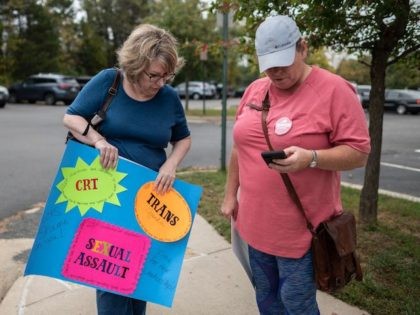 Protesters and activists stand outside a Loudoun County Public Schools (LCPS) board meetin