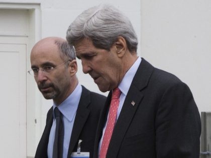 Secretary of State John Kerry (R) walks back to his hotel with Robert Malley (L), a member