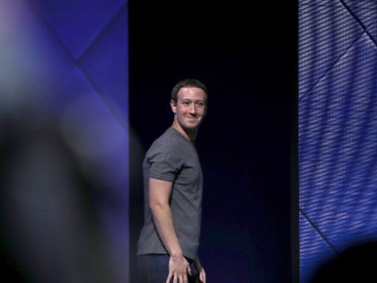 Mark Zuckerberg grins at Facebook meeting