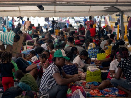 Haitian migrants remain outside a migrant shelter where they await their immigration resolution, in Monterrey, Mexico, on September 26, 2021. - Almost all of the mostly Haitian migrants who had gathered on both sides of the US-Mexico border have left their makeshift camps, ending a standoff that had provoked a …