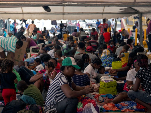 Haitian migrants remain outside a migrant shelter where they await their immigration resolution, in Monterrey, Mexico, on September 26, 2021. - Almost all of the mostly Haitian migrants who had gathered on both sides of the US-Mexico border have left their makeshift camps, ending a standoff that had provoked a major border crisis for the Biden administration. (Photo by Julio Cesar AGUILAR / AFP) (Photo by JULIO CESAR AGUILAR/AFP via Getty Images)