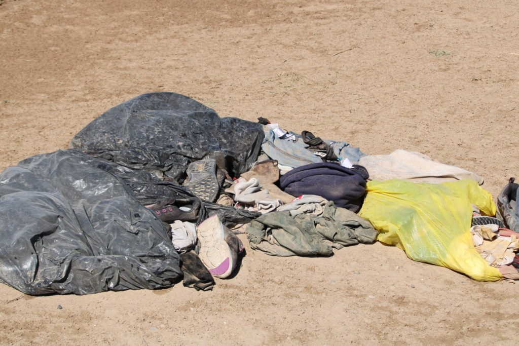 Piles of discarded clothing reveal evidence of large-scale illegal border crossings near Eagle Pass, Texas. (Construction crews ready a temporary concrete factory near border. (Photo: Randy Clark/Breitbart Texas)