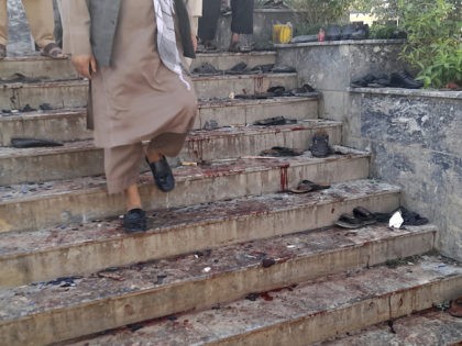 A blood-stained are seen outside a mosque following a bombing in Kunduz province northern Afghanistan, Friday, Oct. 8, 2021. A powerful explosion in a mosque frequented by a Muslim religious minority in northern Afghanistan on Friday has left several casualties, witnesses and the Taliban's spokesman said. (AP Photo/Abdullah Sahil)