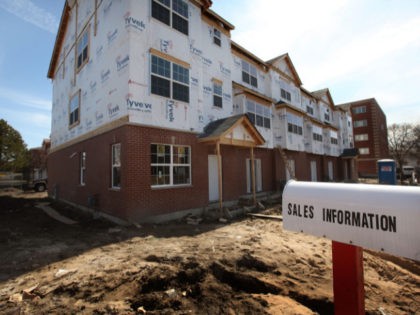 DES PLAINES, IL - MARCH 16: A multi-family condominium project is under construction on March 16, 2011 in Des Plaines, Illinois. Request for building permits in February, a leading indicator for the strength of the housing industry, fell 8.2%, to a seasonally adjusted 517,000 units, a record low. Single-family home …