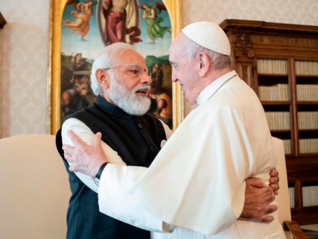 India's Prime Minister Narendra Modi, left, and Pope Francis hug on the occasion of their private audience at the Vatican, Saturday, Oct. 30, 2021. Modi is in Rome for the Group of 20 summit. (Vatican Media via AP)