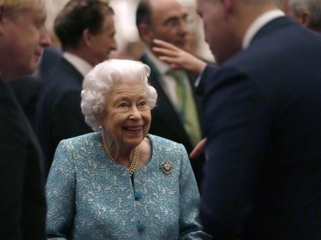 FILE - In this Tuesday, Oct. 19, 2021 file photo, Britain's Queen Elizabeth II and Prime M