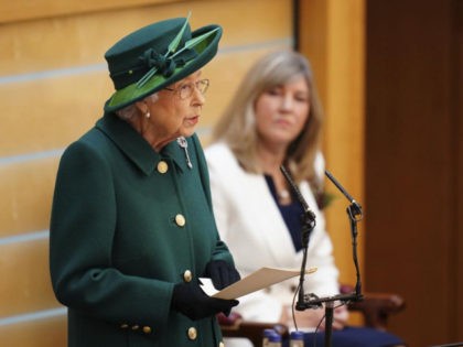 Britain's Queen Elizabeth II delivers her speech in the debating chamber to mark the official start of the sixth session of the Scottish Parliament, in Edinburgh, Scotland, Saturday, Oct. 2, 2021. (Jane Barlow/Pool Photo via AP)