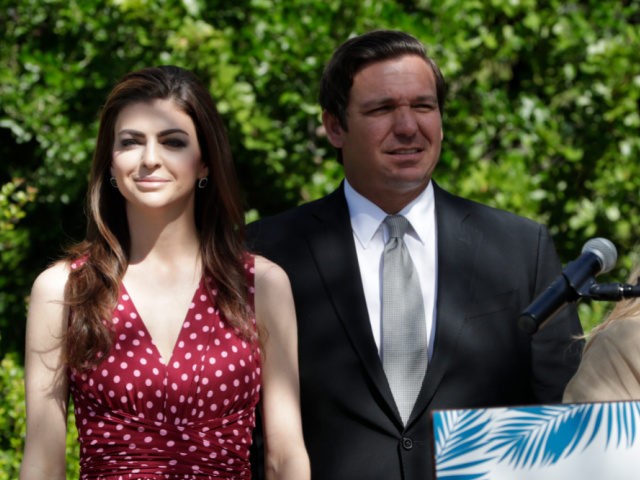 Florida Gov. Ron DeSantis, right, stands with his wife Casey during a news conference where the Miami Super Bowl Host Committee announced the launch of Ocean to Everglades (O2E), a Super Bowl LIV environmental initiative, at the Marjory Stoneman Douglas Biscayne Nature Center, Monday, April 22, 2019, in Key Biscayne, …