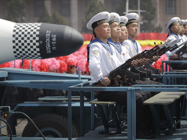 In this April 15, 2017, file photo, navy personnel sit in front of a submarine-launched "Pukguksong" ballistic missile (SLBM) as it is paraded across Kim Il Sung Square in Pyongyang, North Korea. (AP Photo/Wong Maye-E, File)