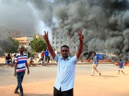 A Sudanese demonstrator flashes the victory sign during a demonstration in the capital Khartoum, on October 25, 2021, to denounce overnight detentions by the army of members of Sudan's government. (AFP via Getty Images)