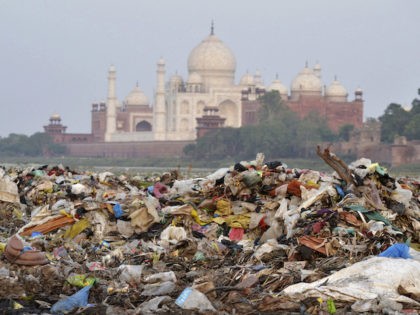 In this May 11, 2018 photo, garbage covers the area by the Yamuna river near the Taj Mahal in Agra, India. Built by Mogul Emperor Shah Jahan for his favorite wife in the north Indian city of Agra, the Taj Mahal has been losing its sheen for years. (AP Photo/Pawan …
